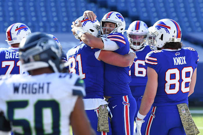 Josh Allen celebrates with teammates after throwing touchdown against Seahawks